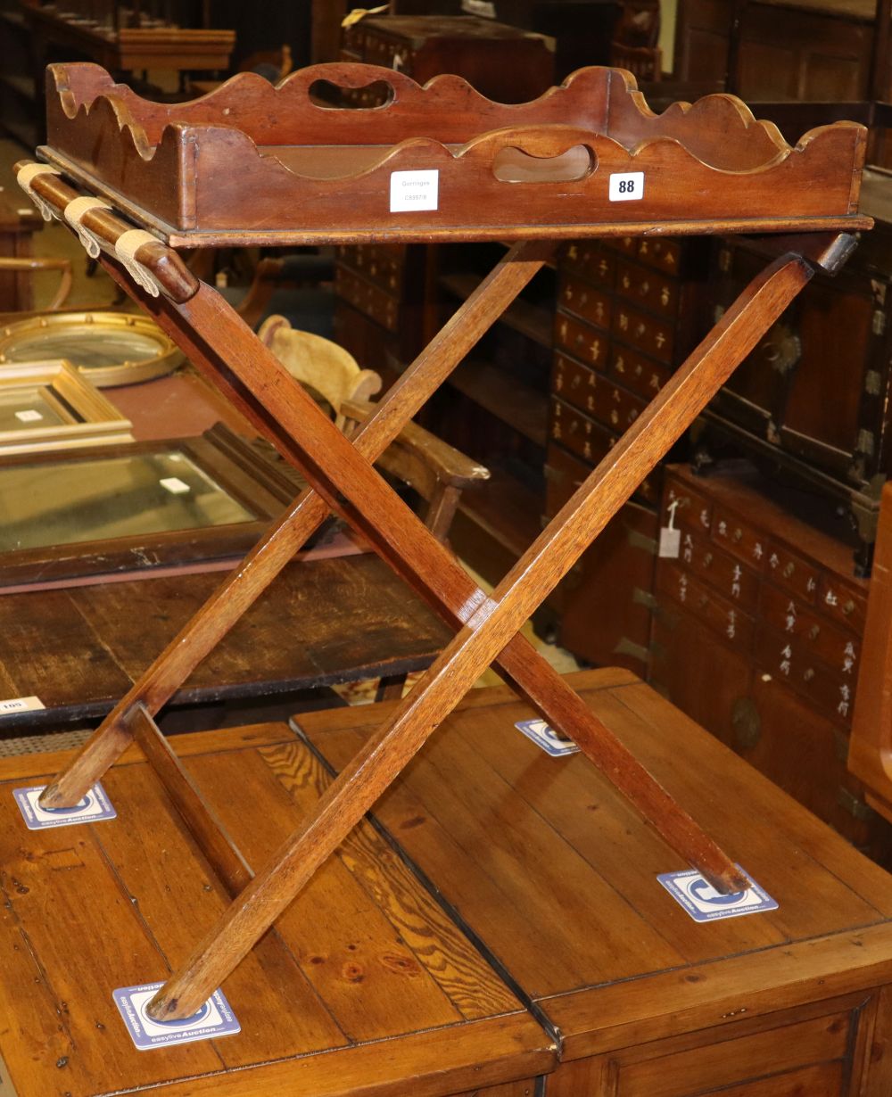 A Victorian mahogany galleried butlers tray, on folding stand, tray W.64cm, D.50cm, H.78cm